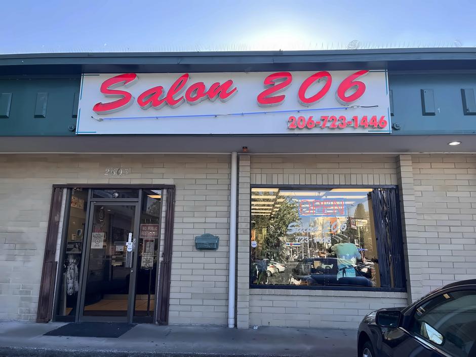 The red Salon 206 sign above the shop entrance at 2603 South McClellan Street, Seattle